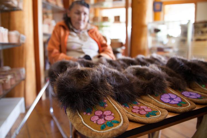 Person selling at the Liard Gift Shop.